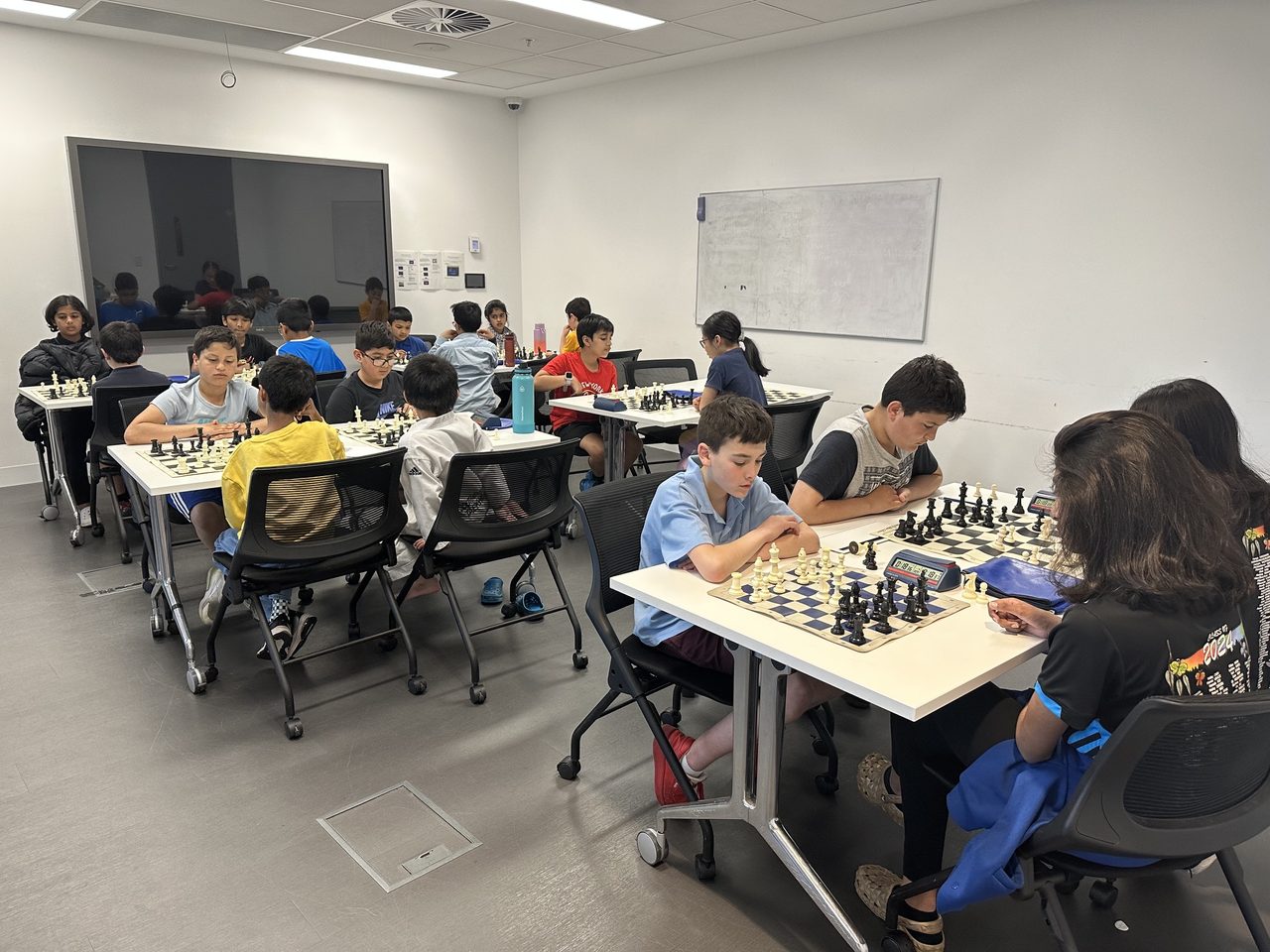 Students playing focused games during an Oz Chess Kids class