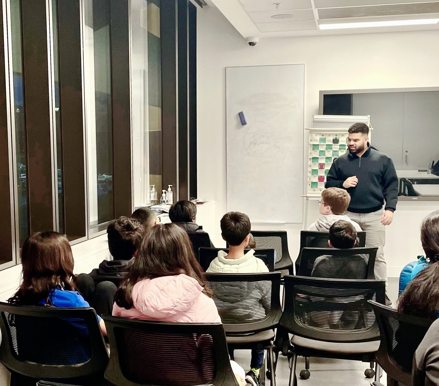 Coach Kheminda teaching a chess class at Oz Chess Kids