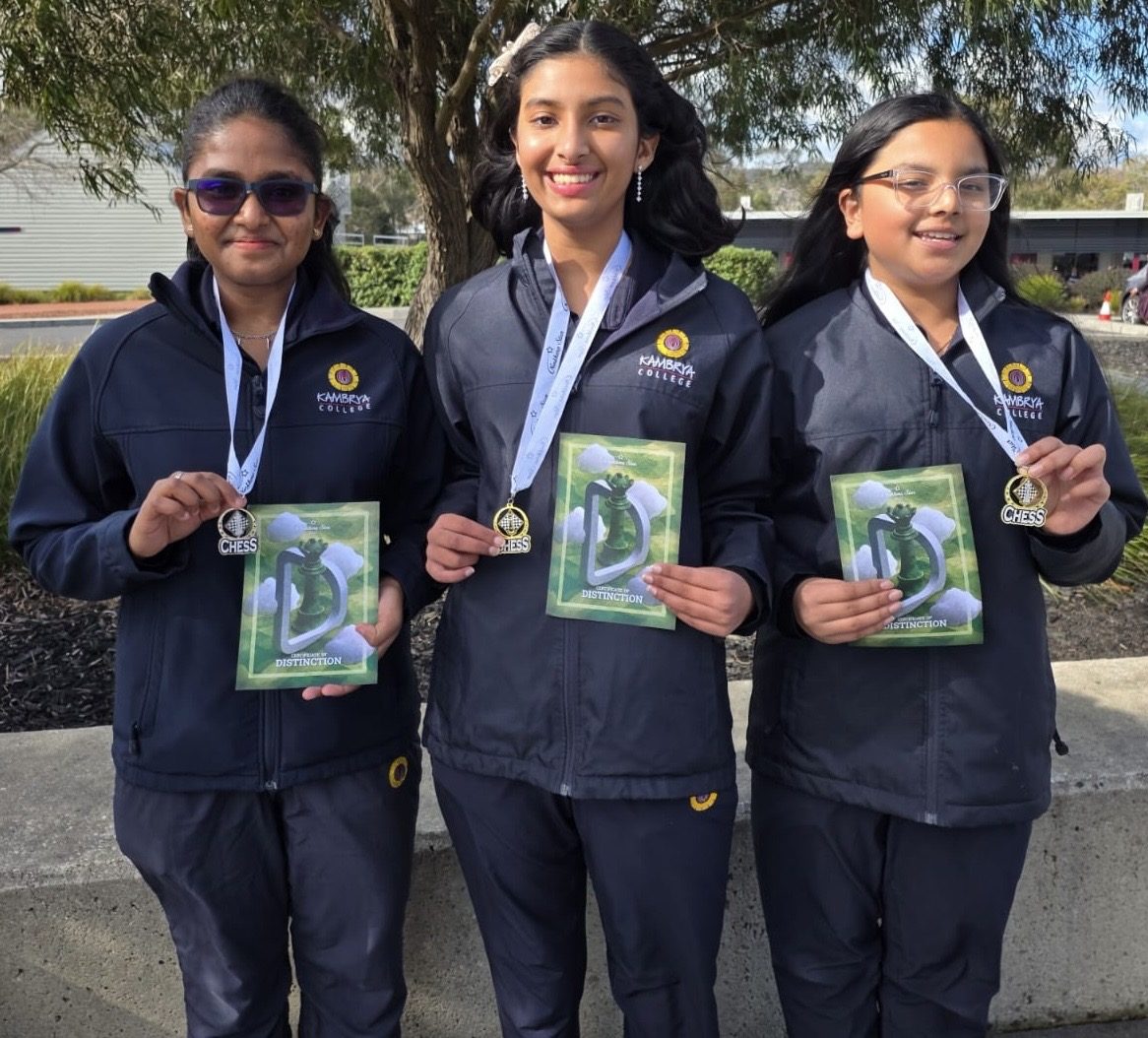 Three Oz Chess Kids students with chess medals and distinction certificates