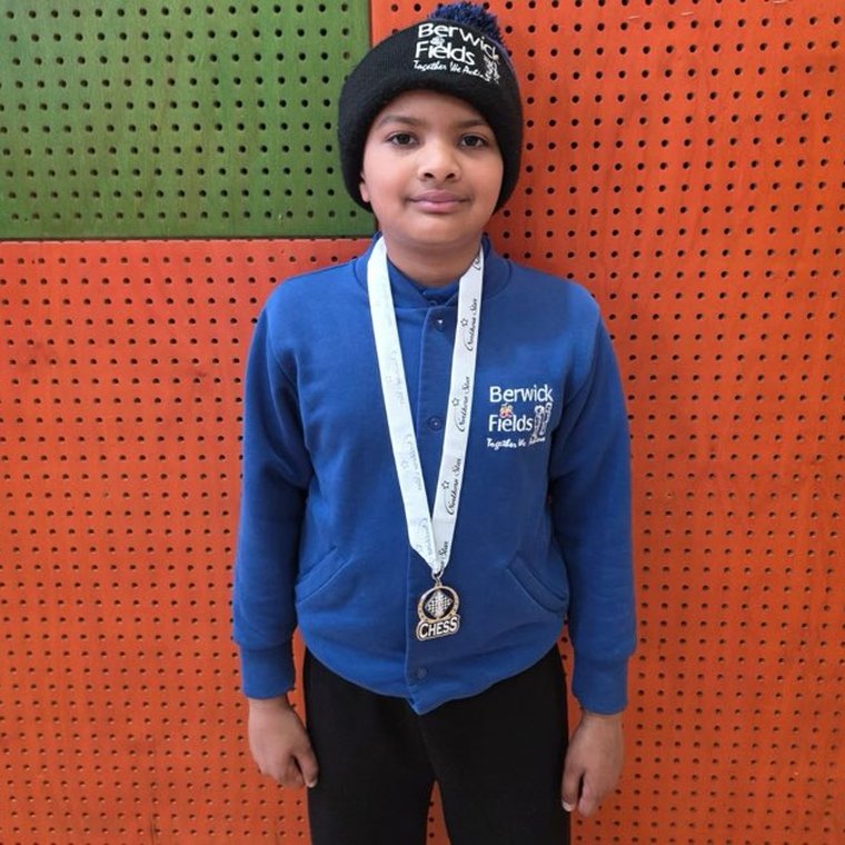 A Berwick Fields Oz Chess Kids student with a chess medal